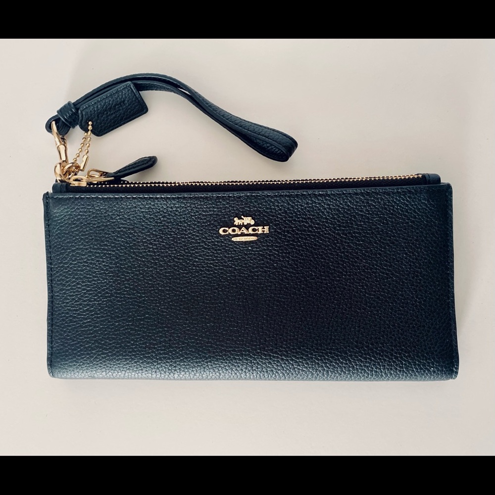 Black Coach Wallet. Two zipper compartments. Twelve card slots.